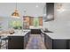 Open kitchen featuring a central island, updated appliances, and contemporary finishes at 1400 Hedgelawn, Raleigh, NC 27615
