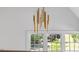 Landing with windows and a modern gold lighting fixture at 1400 Hedgelawn, Raleigh, NC 27615