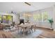 Open-concept living room with a dining area, fireplace, and natural light at 1400 Hedgelawn, Raleigh, NC 27615