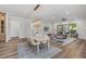 Bright living room featuring hardwood floors, modern furniture, and sliding glass doors for indoor/outdoor living at 1400 Hedgelawn, Raleigh, NC 27615