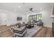 Cozy living room with comfortable seating, a fireplace, and access to an outdoor patio at 1400 Hedgelawn, Raleigh, NC 27615