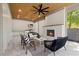 Spacious outdoor living area with grill, fireplace, and ample seating at 1400 Hedgelawn, Raleigh, NC 27615