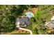 Overhead view of the house, driveway, pool, and surrounding landscaping at 14013 Wallberman Dr, Wake Forest, NC 27587