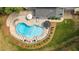 Backyard features in-ground pool, patio dining and seating, slide, and landscaping at 14013 Wallberman Dr, Wake Forest, NC 27587