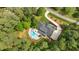 Lush property with an in-ground pool, surrounded by mature trees at 14013 Wallberman Dr, Wake Forest, NC 27587