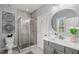 Clean bathroom featuring a glass shower, a vanity, and a modern toilet with unique decorations at 14013 Wallberman Dr, Wake Forest, NC 27587