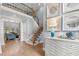 Spacious foyer with hardwood floors, staircase, and chest of drawers, offering a welcoming entrance at 14013 Wallberman Dr, Wake Forest, NC 27587