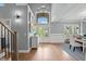Beautiful foyer with hardwood floors, grand staircase, and stylish console table with decorative lamps at 14013 Wallberman Dr, Wake Forest, NC 27587