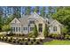 Beautiful two-story home with stone accents, manicured landscaping, and a neatly paved driveway at 14013 Wallberman Dr, Wake Forest, NC 27587