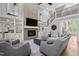 Bright living room with vaulted ceilings, a fireplace, built-in shelves, and plush seating at 14013 Wallberman Dr, Wake Forest, NC 27587