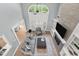 Aerial view of a living room with a fireplace, hardwood floors, and a comfortable seating area at 14013 Wallberman Dr, Wake Forest, NC 27587