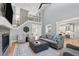 Open-concept living room with fireplace, plush seating, and elegant décor, ideal for entertaining at 14013 Wallberman Dr, Wake Forest, NC 27587