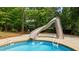 Inviting in-ground pool with a slide and ladder for easy access at 14013 Wallberman Dr, Wake Forest, NC 27587
