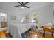 This bedroom has hard wood floors and white walls at 1402 W Lakewood Ave, Durham, NC 27707