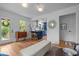 Open living area with hardwood floors and blue kitchen in background at 1402 W Lakewood Ave, Durham, NC 27707