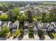 Aerial view of lovely homes with mature trees, manicured lawns and landscaping in a suburban neighborhood at 141 Hilda Grace Ln, Cary, NC 27519