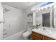 Bathroom with shower-tub combo, vanity, and wall cabinet provides ample storage at 141 Hilda Grace Ln, Cary, NC 27519