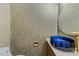 Stylish half bath features a vessel sink, modern faucet, round mirror and decorative wallpaper at 141 Hilda Grace Ln, Cary, NC 27519