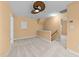 Large bonus room with neutral walls, carpet flooring, ceiling fan, and staircase access to the next level at 141 Hilda Grace Ln, Cary, NC 27519