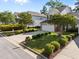 Well-kept home exterior featuring green lawn, driveway and manicured bushes, a great curb appeal at 141 Hilda Grace Ln, Cary, NC 27519