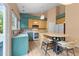 Well-lit kitchen with a center island, modern appliances, and a sink under a window at 141 Hilda Grace Ln, Cary, NC 27519