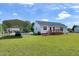 Spacious backyard featuring a carport and wooden deck, perfect for outdoor living at 141 Montesino Dr, Raleigh, NC 27603