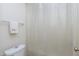 Basic bathroom with clear shower curtain, commode, and towel bar at 141 Montesino Dr, Raleigh, NC 27603