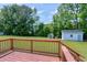 Spacious wooden deck overlooking a large, well-maintained backyard with storage sheds at 141 Montesino Dr, Raleigh, NC 27603