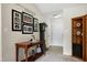 Cozy entryway with wooden furniture, decor, and tile flooring at 141 Montesino Dr, Raleigh, NC 27603