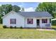 Charming single-story home featuring red shutters and a well-maintained front yard at 141 Montesino Dr, Raleigh, NC 27603