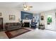Inviting living room with a fireplace, ceiling fan, and comfortable seating at 141 Montesino Dr, Raleigh, NC 27603