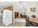 Inviting living room area featuring a vaulted ceiling, neutral carpeting, and seamless access to the adjacent kitchen at 141 Montesino Dr, Raleigh, NC 27603