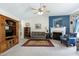 Bright living room featuring a fireplace, plush seating, and natural light at 141 Montesino Dr, Raleigh, NC 27603