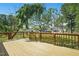 Spacious deck overlooks a backyard with lush green grass and tree line at 1429 Raybon Dr, Wendell, NC 27591