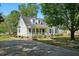Beautiful two-story home featuring a well-manicured lawn, inviting porch and a paved driveway at 1429 Raybon Dr, Wendell, NC 27591