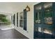 Inviting covered porch with views, featuring a blue door and a lantern-style light fixture at 1429 Raybon Dr, Wendell, NC 27591