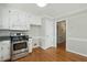 Charming kitchen featuring stainless steel appliances, granite counters, and hardwood floors at 1429 Raybon Dr, Wendell, NC 27591