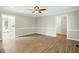 Spacious living room with hardwood floors, neutral walls, and white trim details at 1429 Raybon Dr, Wendell, NC 27591