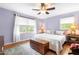 Bedroom with a cozy bed, hardwood floors, and natural light from the window at 149 Baldwin Dr, Durham, NC 27712