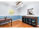 Dining room with hardwood floors, two-tone walls, and modern lighting at 149 Baldwin Dr, Durham, NC 27712