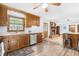 Kitchen featuring wood cabinets, stainless steel appliances, and a view into the dining area at 149 Baldwin Dr, Durham, NC 27712