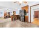 Open concept kitchen boasts stainless steel appliances, wood cabinets, and a breakfast bar at 149 Baldwin Dr, Durham, NC 27712
