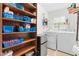 Laundry room with a pantry, offering ample storage, a washer, and a dryer at 149 Baldwin Dr, Durham, NC 27712