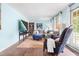 Comfortable living room features a sectional sofa, hardwood floors, and large windows offering ample light at 149 Baldwin Dr, Durham, NC 27712