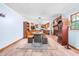 Open floorplan with dining area, kitchen, fireplace, and wood-look flooring at 149 Baldwin Dr, Durham, NC 27712