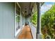 Inviting covered porch with a neutral color scheme offering a relaxing outdoor space at 149 Baldwin Dr, Durham, NC 27712