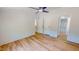 Spacious bedroom with wood-look flooring, ceiling fan, and closet at 1622 Julian Oakley Rd, Rougemont, NC 27572