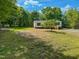 Charming home surrounded by a lush yard and mature trees at 1622 Julian Oakley Rd, Rougemont, NC 27572
