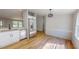 Kitchen with stainless steel appliances, white cabinets, and wood-look flooring at 1622 Julian Oakley Rd, Rougemont, NC 27572