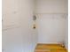 Laundry room featuring wood-look flooring and overhead shelving at 1622 Julian Oakley Rd, Rougemont, NC 27572